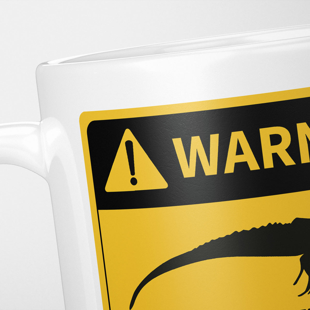 Close crop of the Iguanas warning sign, the hazard triangle and 'warning' above an iguana silhouette