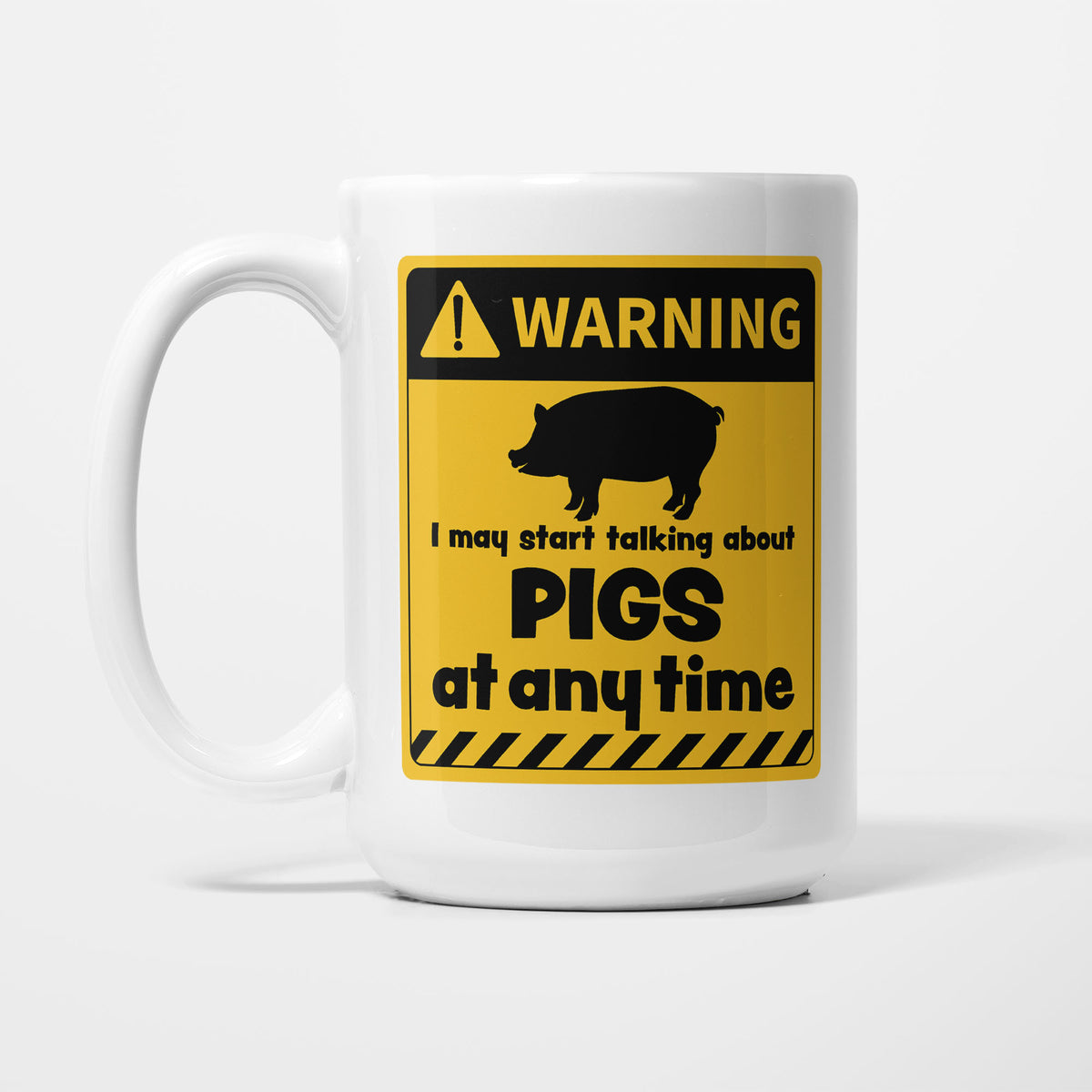 The 15oz Warning mug, white ceramic with a yellow and black warning sign showing a pig silhouette above 'I may start talking about Pigs at any time'