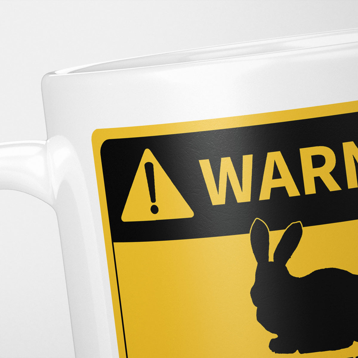Close crop of the Rabbits warning sign, the hazard triangle and 'warning' above a rabbit silhouette