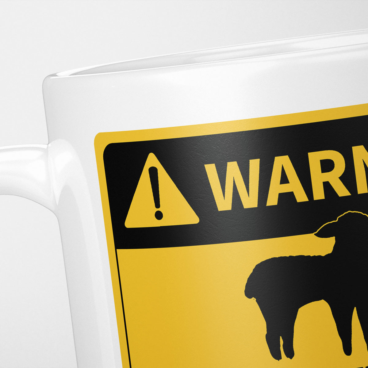 Close crop of the Sheep warning sign, the hazard triangle and 'warning' above a sheep silhouette