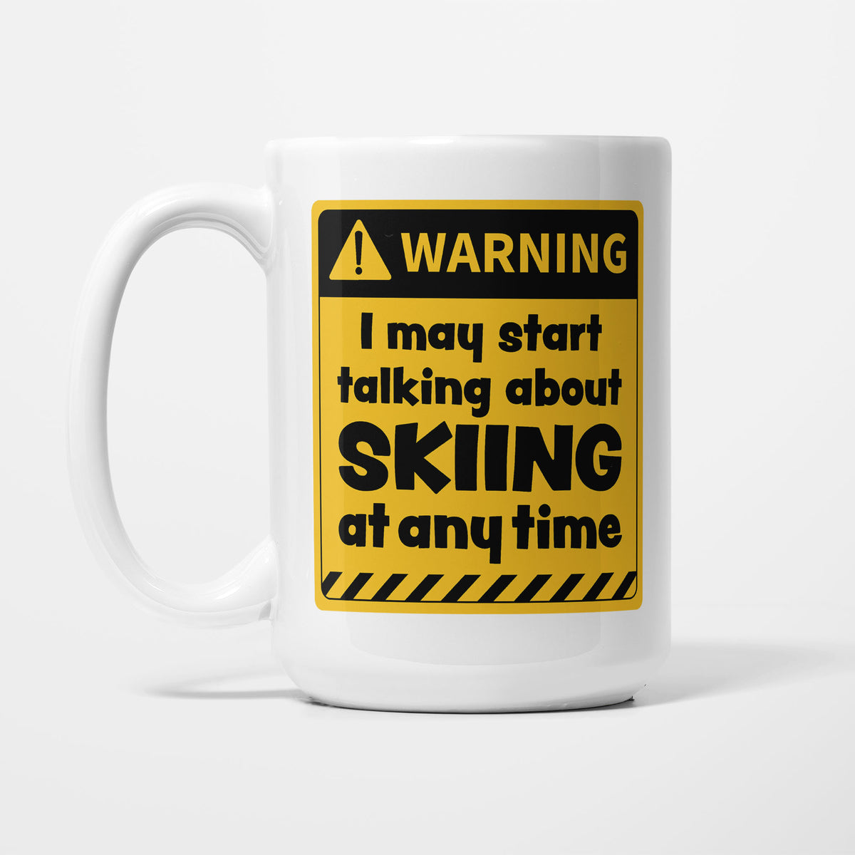 The 15oz Warning mug, white ceramic with a yellow and black warning sign reading 'I may start talking about Skiing at any time'