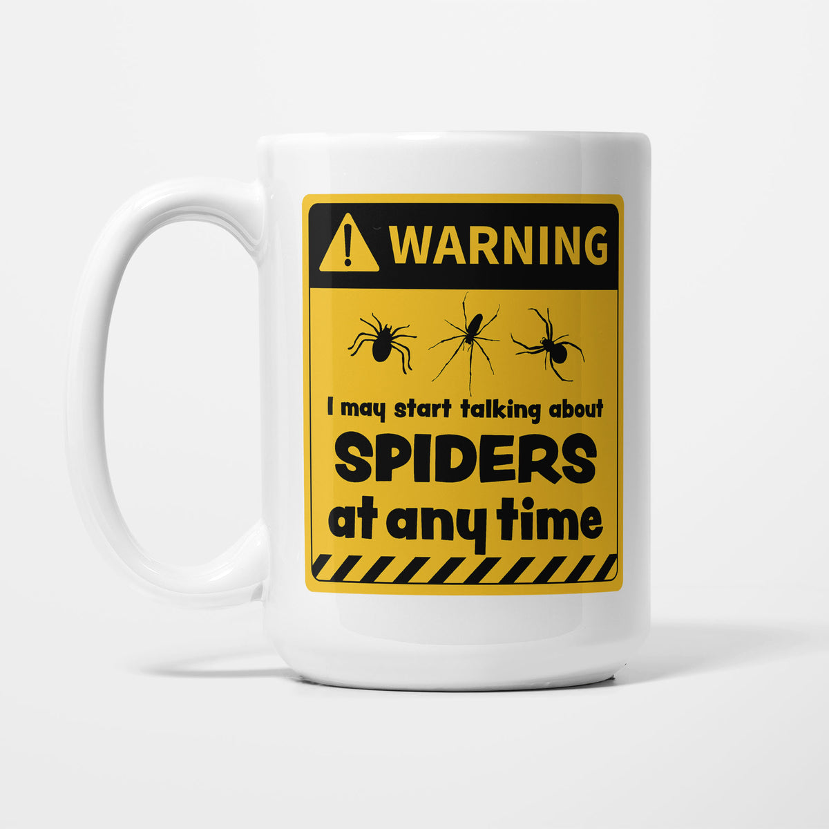 The 15oz Warning mug, white ceramic with a yellow and black warning sign showing three spider silhouettes above 'I may start talking about Spiders at any time'