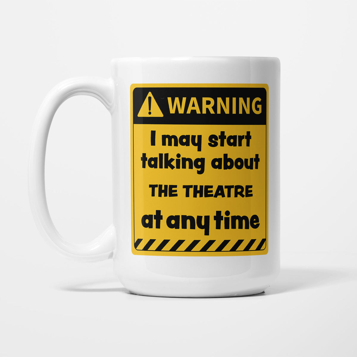 The 15oz Warning mug, white ceramic with a yellow and black warning sign reading 'I may start talking about The Theatre at any time'