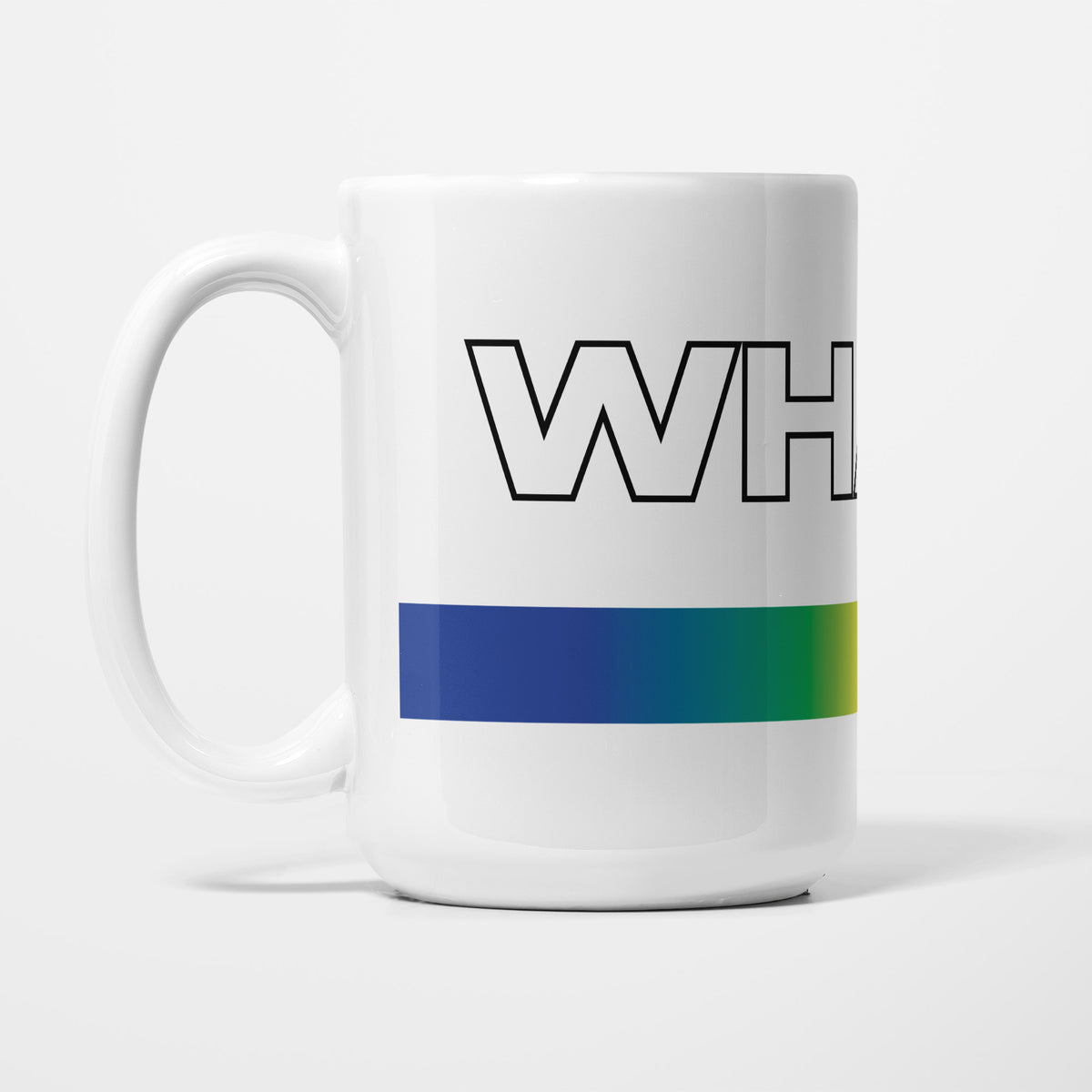 Left side of the 15oz Wham! 1980s Music Icons mug, white ceramic with 'Wham!' in outlined eighties lettering above a wraparound gradient stripe running blue, green, yellow, orange and red