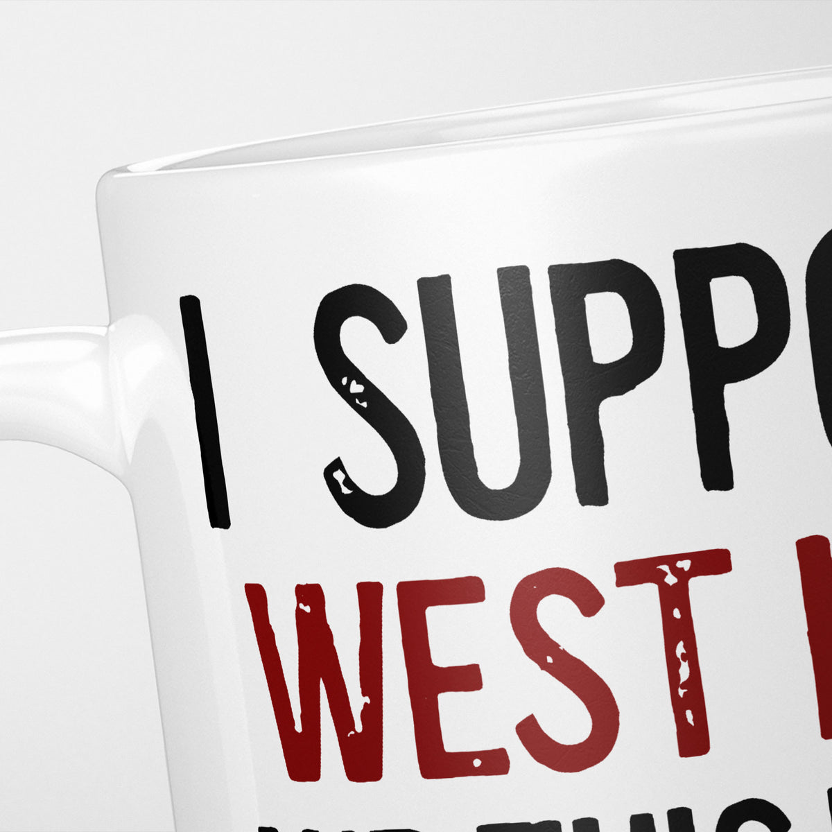 Close crop of the I Support West Ham mug, 'I Support' in heavy black above the club name in claret, running off the edge of the frame
