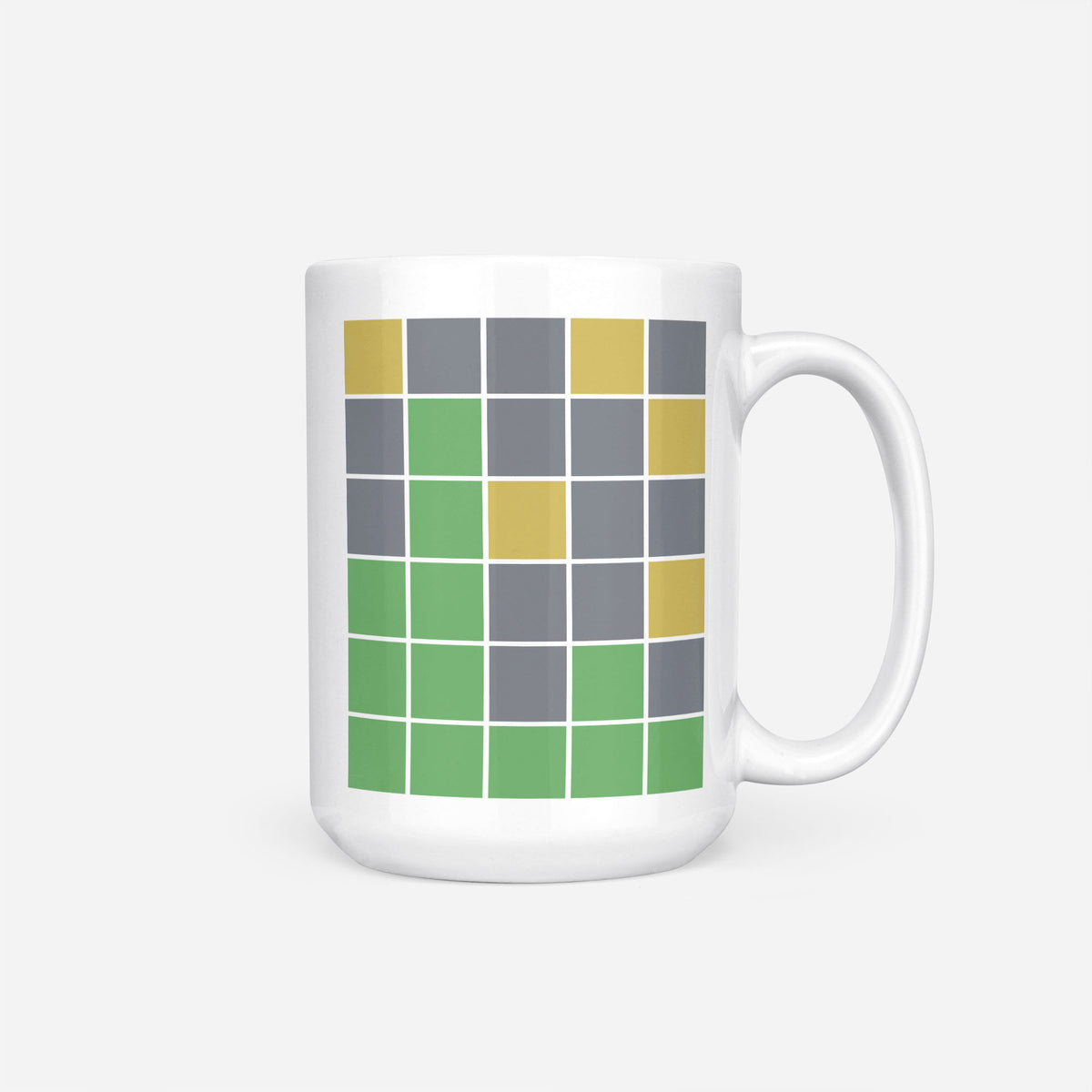 The 15oz Wordle Game Grid mug, white ceramic printed with a Wordle-style grid of green, yellow and grey tiles with no letters