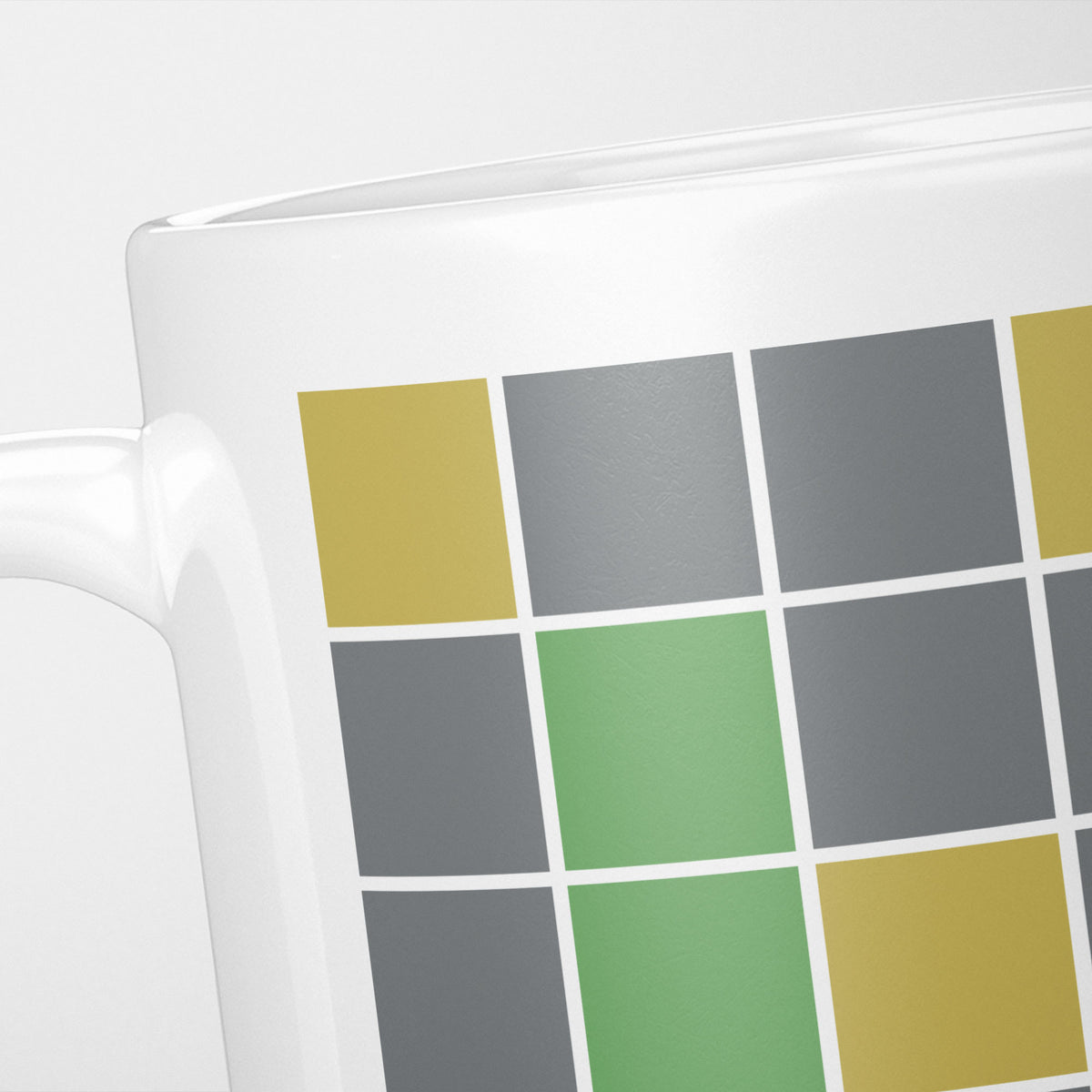 Close crop of the Wordle Game Grid mug, blank green, yellow and grey tiles