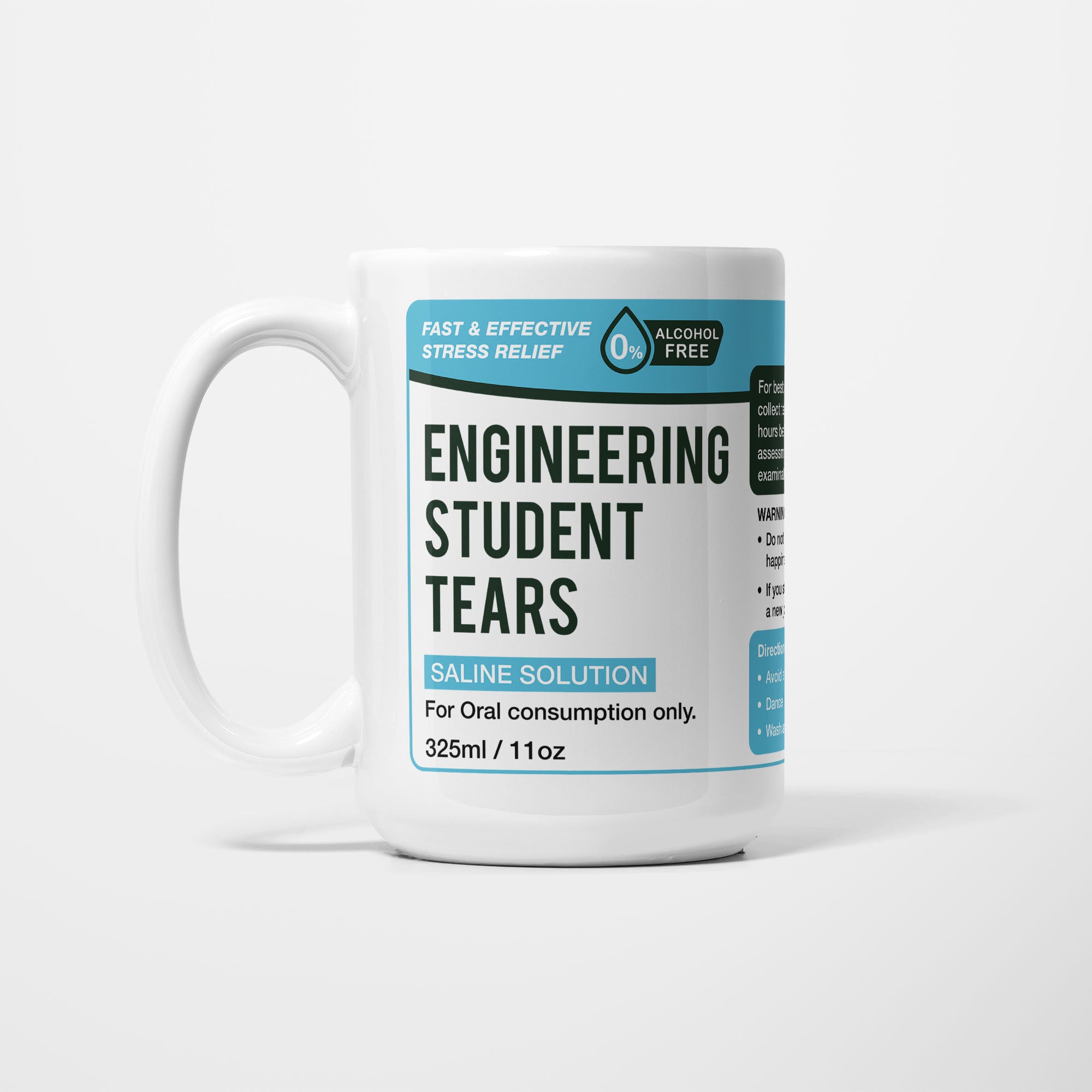 The 15oz Engineering Student Tears mug, white ceramic with a teal pharmacy-style label reading 'Engineering Student Tears — Saline Solution, for oral consumption only'