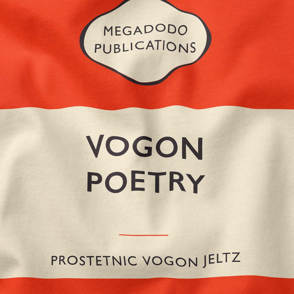 Close-up of the print on the Vogon Poetry Orange Hitchhiker's Guide Unisex T-Shirt in Orange — the cream centre band reading “Vogon Poetry” above “Prostetnic Vogon Jeltz”, with the Megadodo Publications cartouche above it
