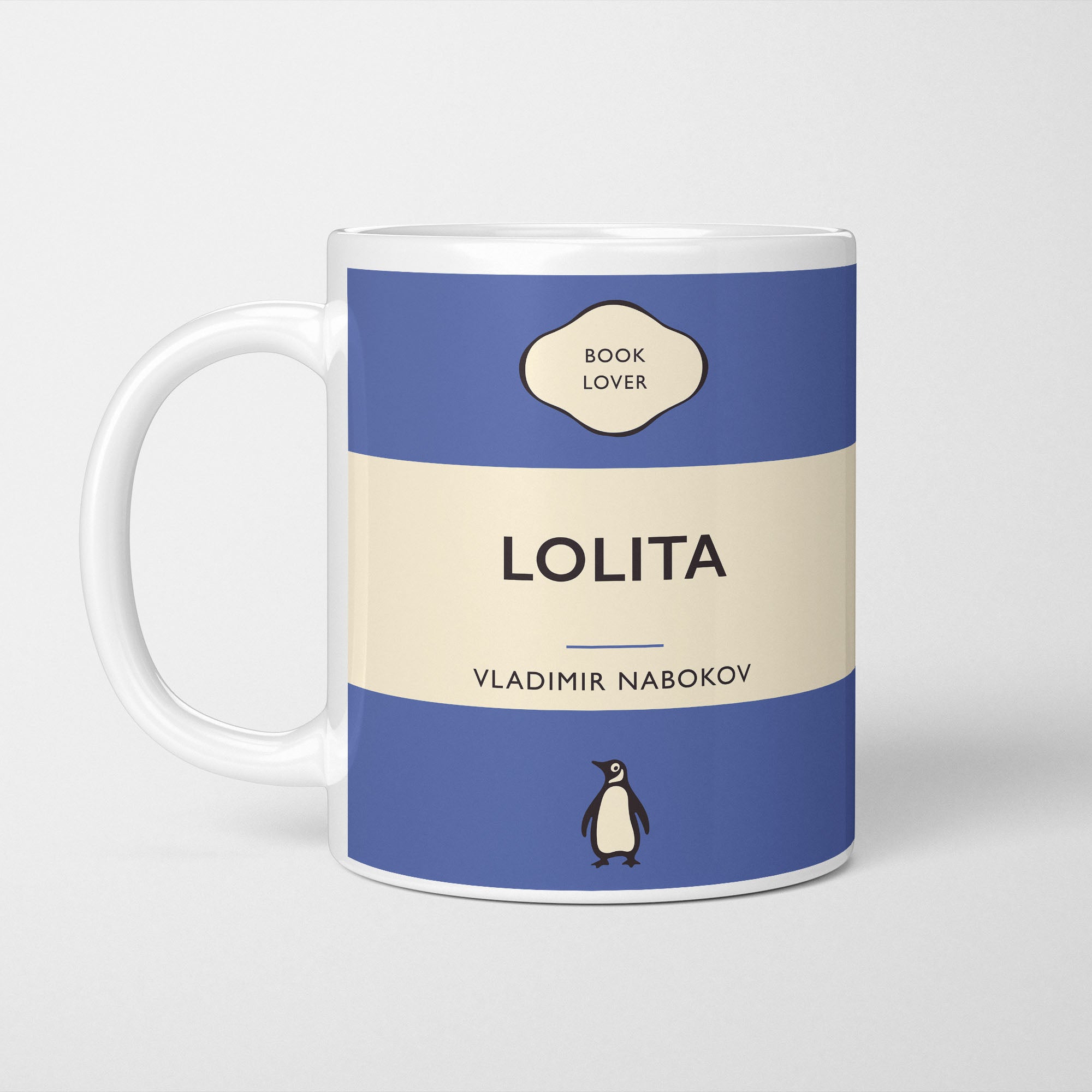 White ceramic mug printed with a vintage-style book cover design reading 'Lolita' by Vladimir Nabokov