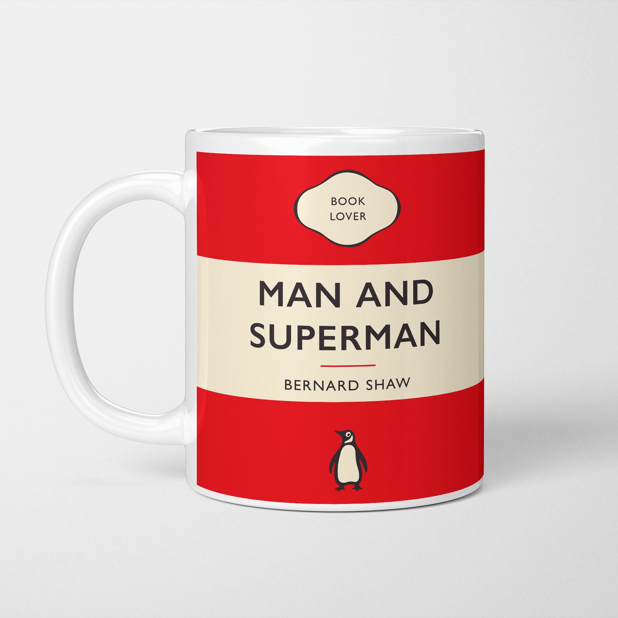 White ceramic mug printed with a vintage-style book cover design reading 'Man and Superman' by Bernard Shaw