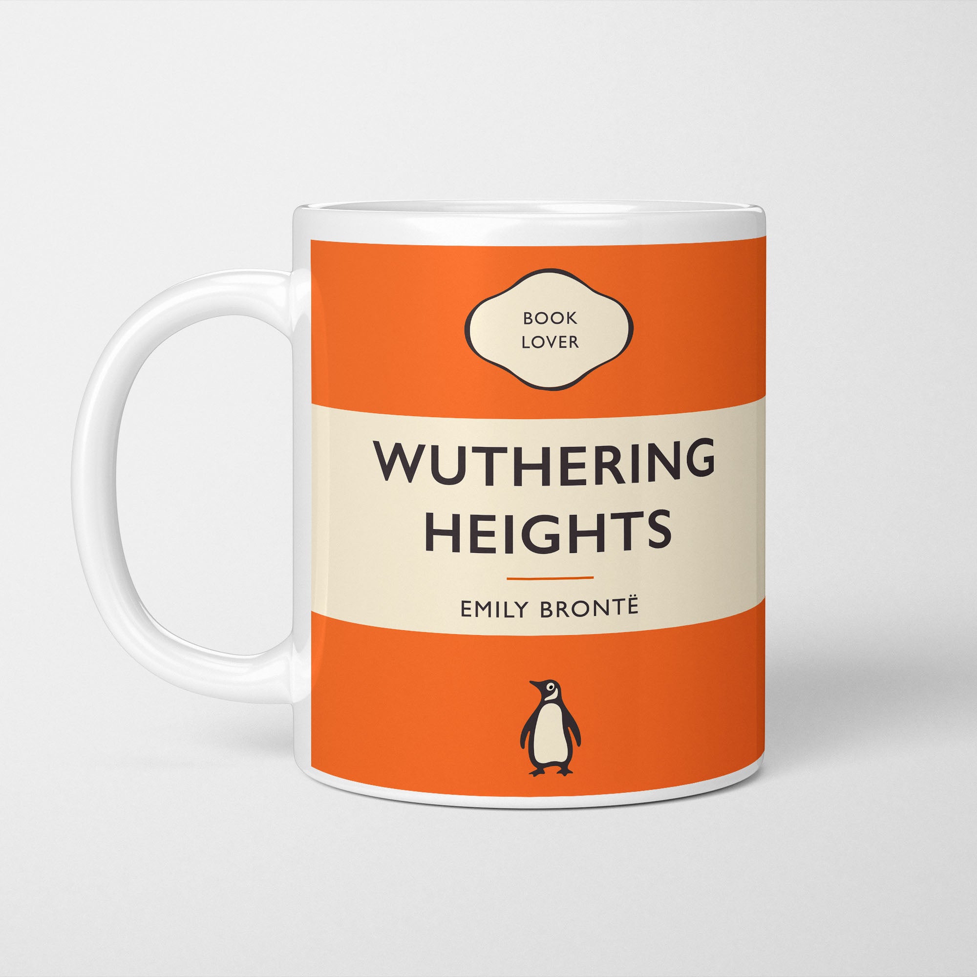 White ceramic mug printed with a vintage-style book cover design reading 'Wuthering Heights' by Emily Bronte